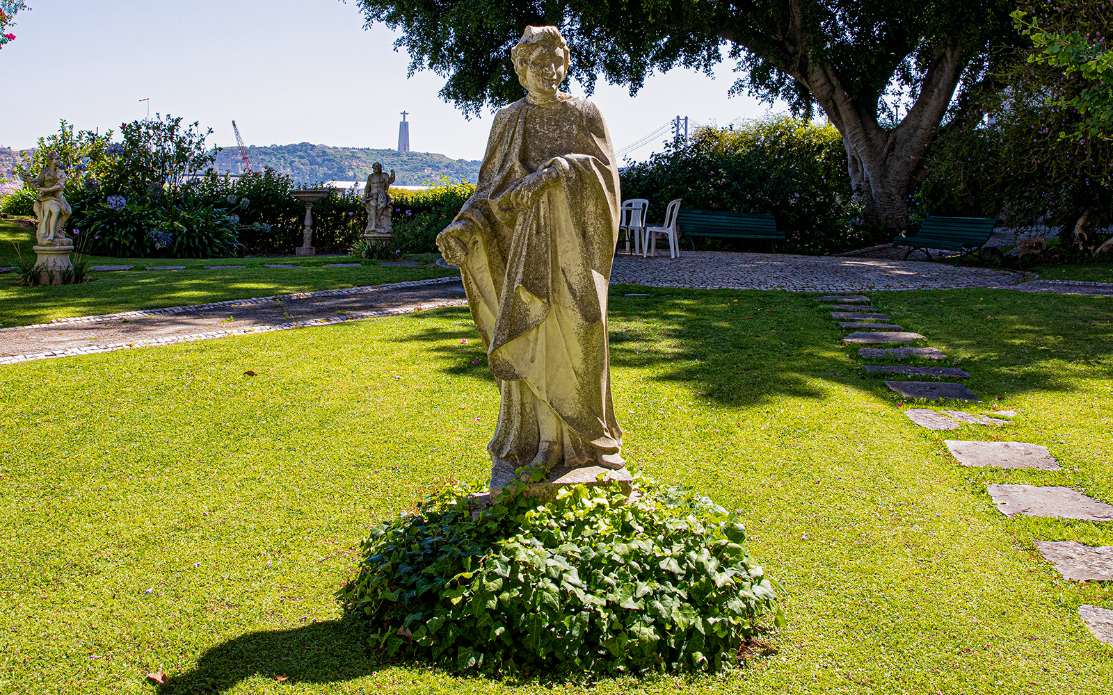 Stone statue in the garden of the National Museum of Ancient Art, Lisbon.
