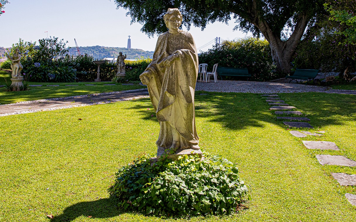 Stone statue in the garden of the National Museum of Ancient Art, Lisbon.