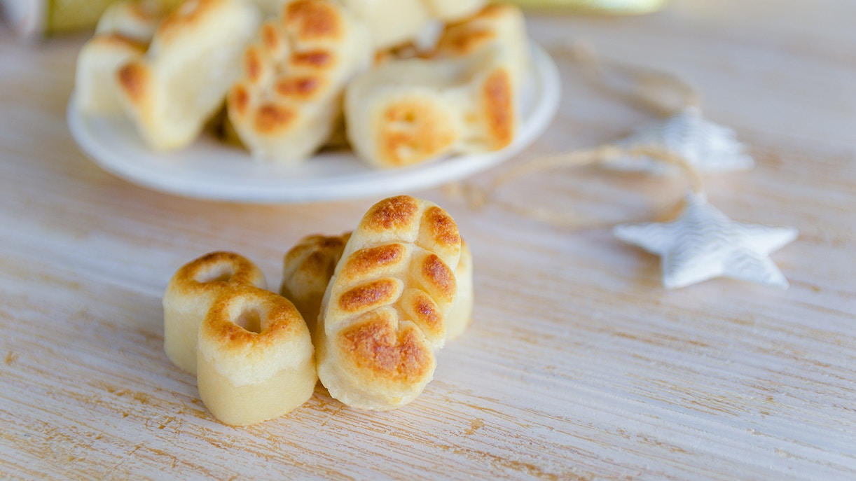 Spanish marzipan pastries on a wooden table in Toledo.
