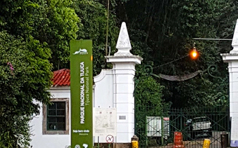 Entrance to Tijuca National Park with sign and gate, Rio de Janeiro.