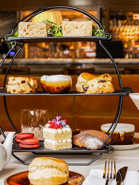 Afternoon tea set with sandwiches, scones, and pastries at the National Gallery London.