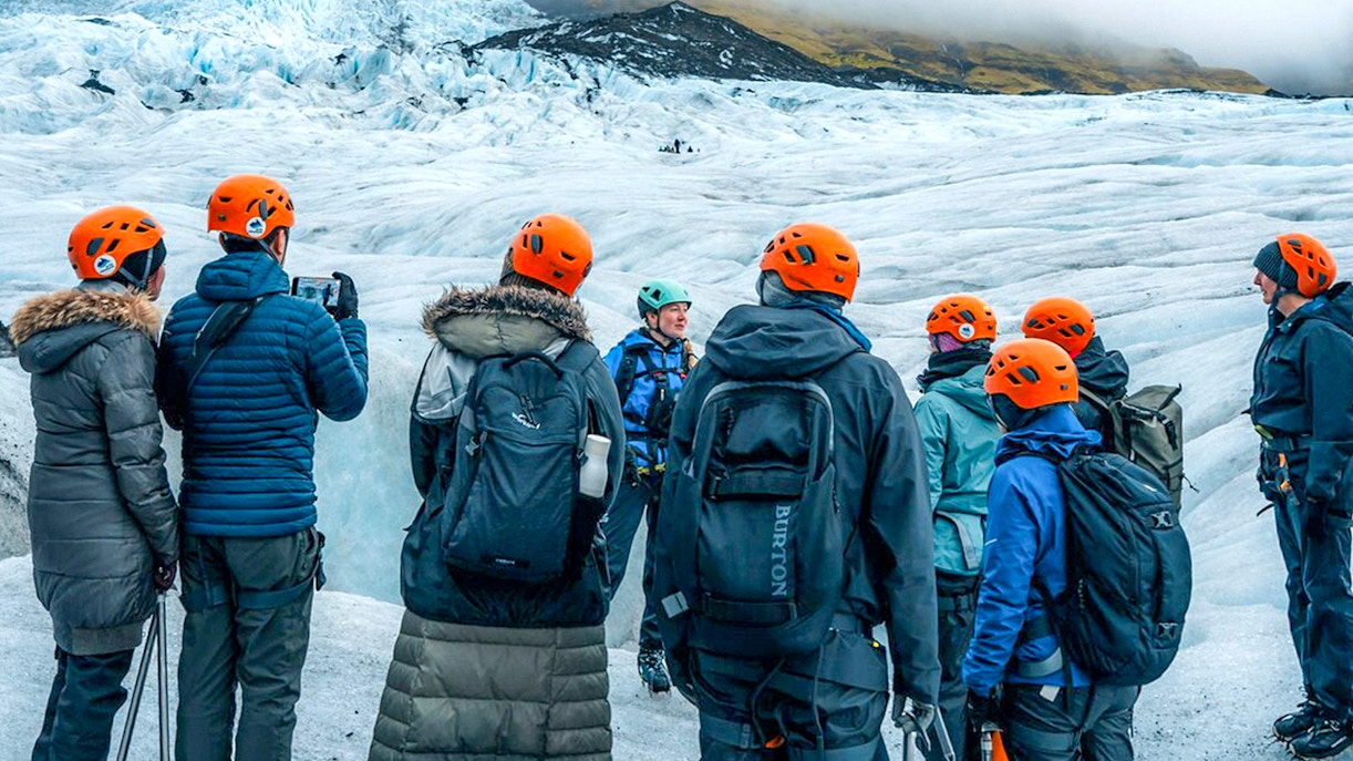 Tour guide explaining to guests during Blue Ice Cave & Glacier Hike on Vatnajökull from Skaftafell.
