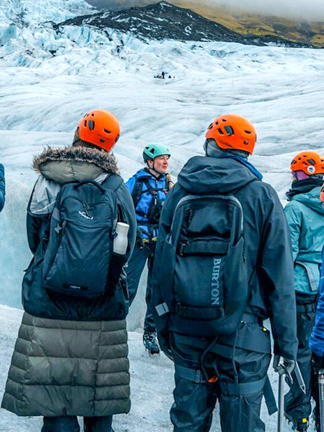 Tour guide explaining to guests during Blue Ice Cave & Glacier Hike on Vatnajökull from Skaftafell.