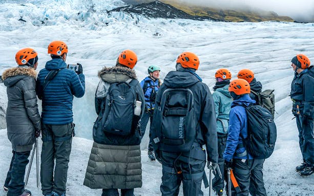Tour guide explaining to guests during Blue Ice Cave & Glacier Hike on Vatnajökull from Skaftafell.