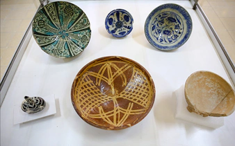 Ceramic artifacts displayed at the Amman Citadel Museum during the Amman City Sightseeing Tour.