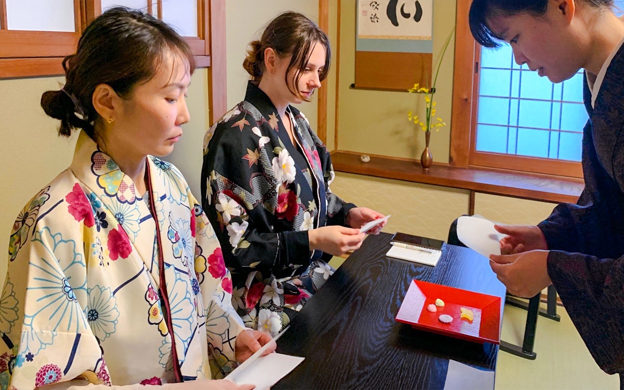 Guests participating in a traditional tea ceremony in Kyoto, Japan.