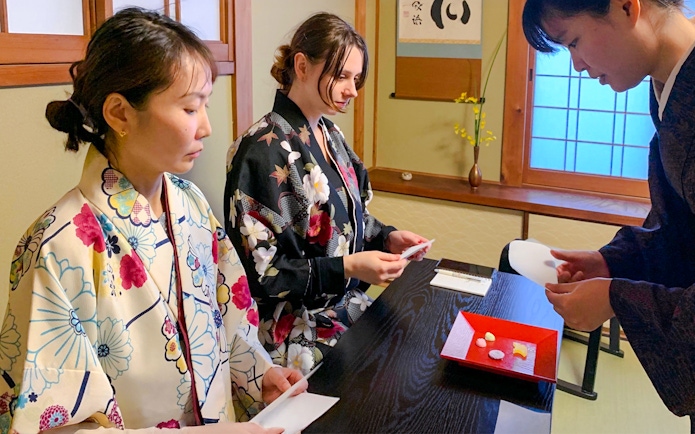 Guests participating in a traditional tea ceremony in Kyoto, Japan.