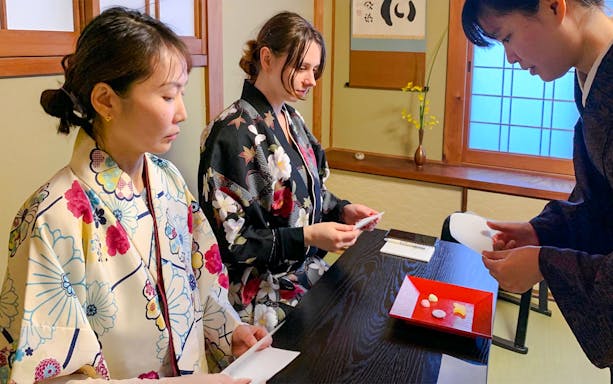 Guests participating in a traditional tea ceremony in Kyoto, Japan.