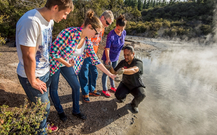 Guided group exploring geothermal features at Hells Gate, Medicine Lake.