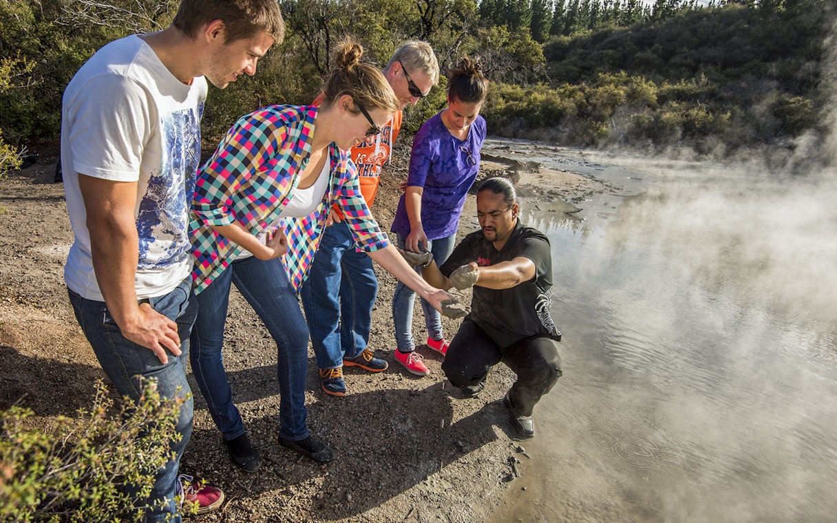 Guided group exploring geothermal features at Hells Gate, Medicine Lake.