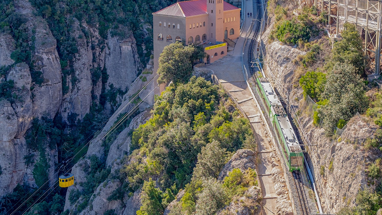Montserrat Monastery with cog-wheel train and scenic mountain views on guided tour.