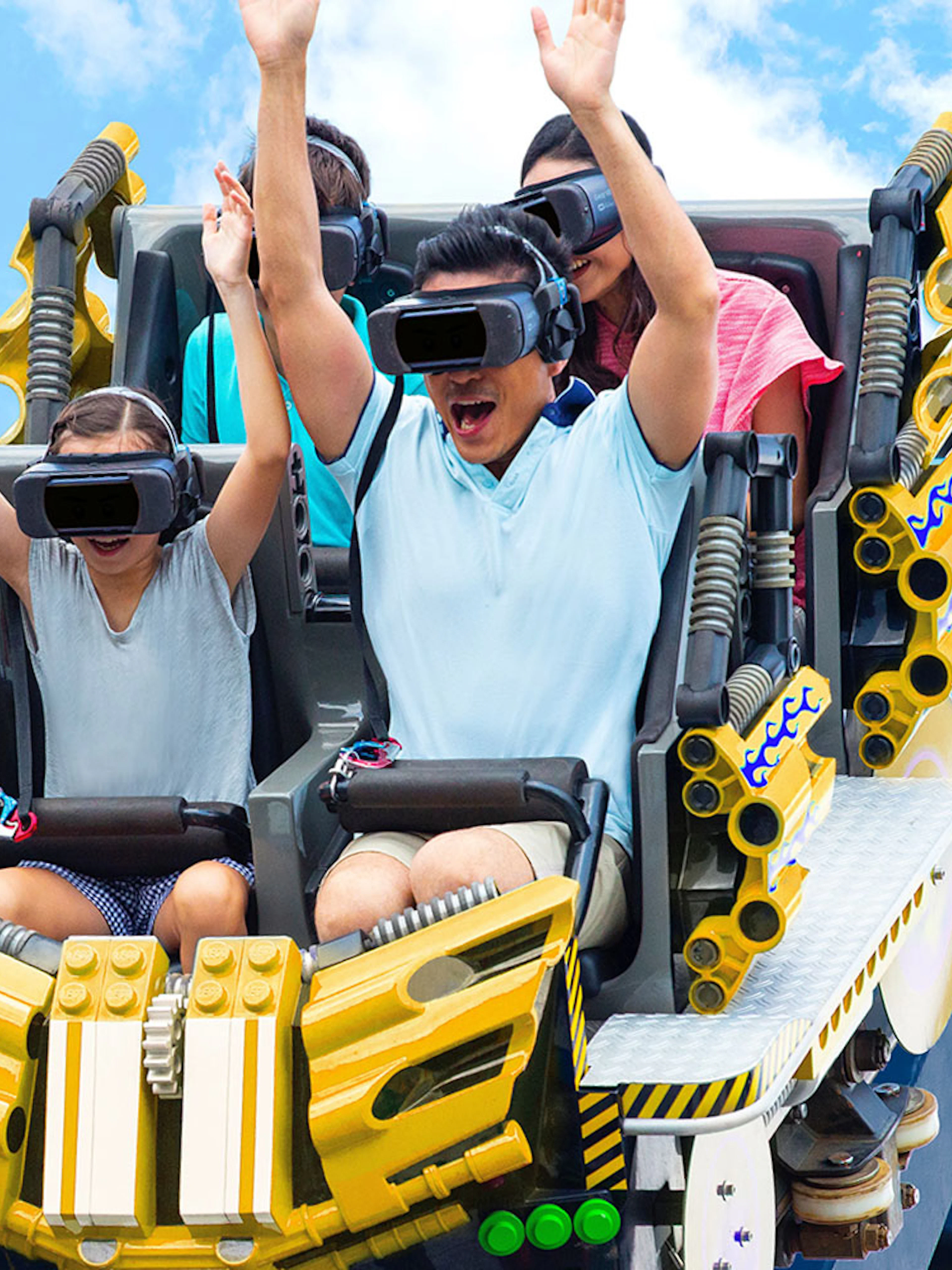 Family enjoying VR roller coaster at Legoland Malaysia.