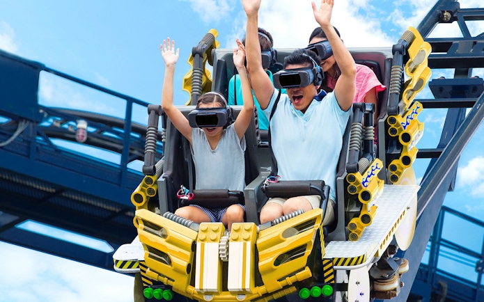 Family enjoying VR roller coaster at Legoland Malaysia.