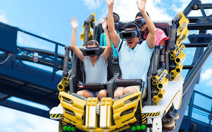 Family enjoying VR roller coaster at Legoland Malaysia.