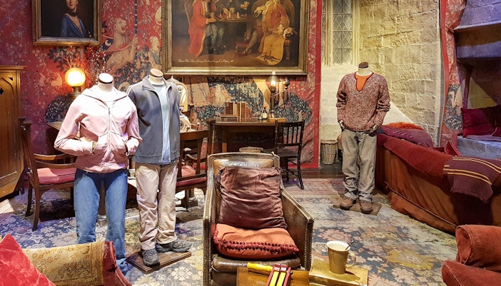 Gryffindor common room set at Harry Potter Studio Tour, featuring iconic film props.