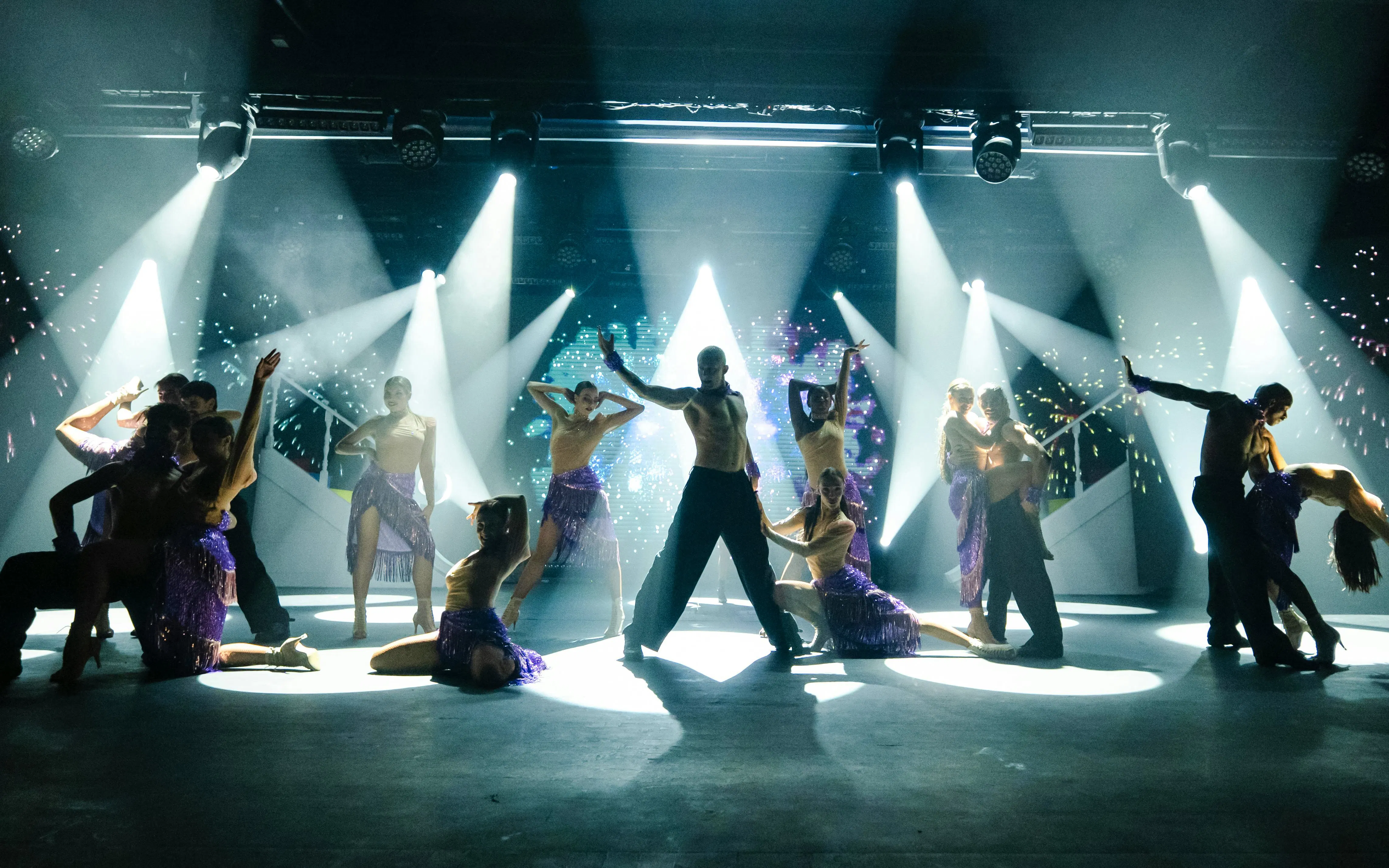 Dancers performing on stage with dramatic lighting at Sala Scala, Gran Canaria.