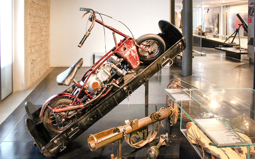Motorcycle display at Invalides museum, Paris, part of Napoleon's Tomb tour.