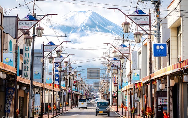 Street view of Hikawa Clock Shop with Mt. Fuji in the background, Japan.