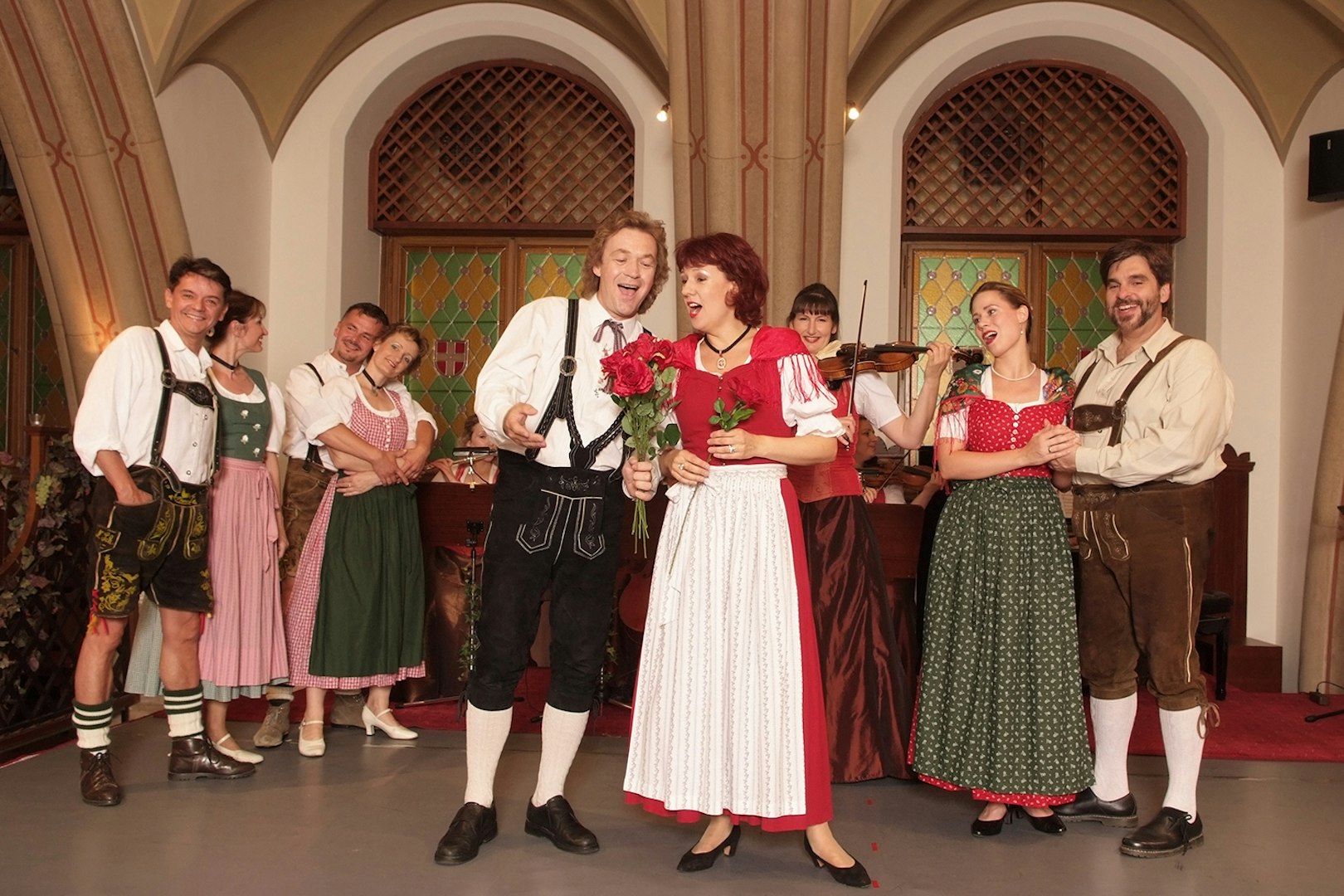 Performers in traditional attire at a Waltz- & Operetta Dinner Show, Vienna city hall.