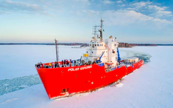 Icebreaker cruise ship navigating frozen sea during Icebreaker Cruise & Ice Floating Experience.
