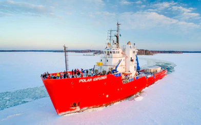 Icebreaker cruise ship navigating frozen sea during Icebreaker Cruise & Ice Floating Experience.