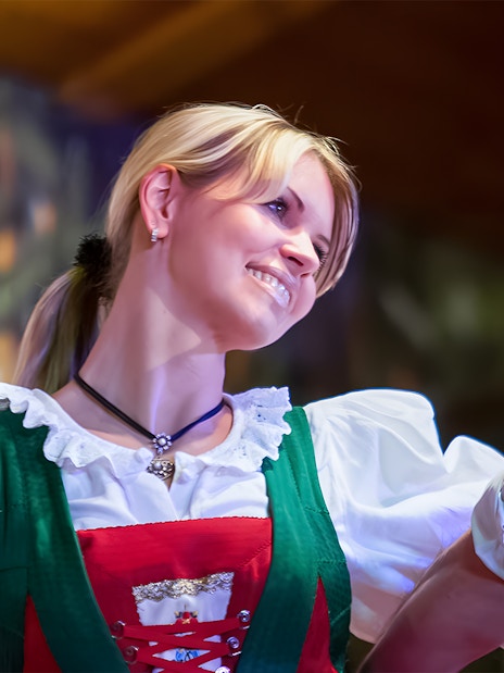 Dancers in traditional Tyrolean attire performing at the Gundolf Family Folk Show.