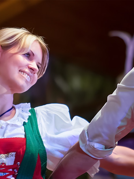 Dancers in traditional Tyrolean attire performing at the Gundolf Family Folk Show.