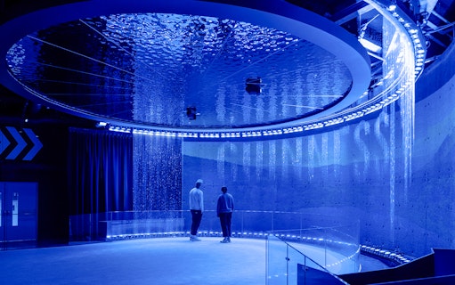 Guests exploring interactive exhibits inside the Guinness Storehouse.