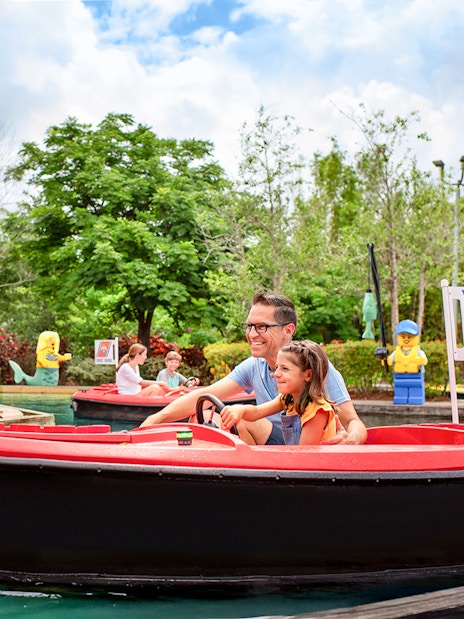 Father and daughter in a boat at Coast Guard Academy, LEGOLAND Florida.