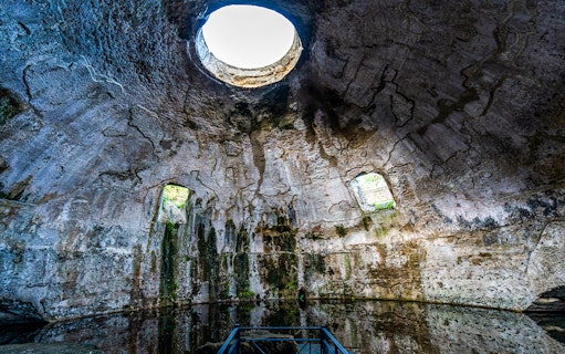 Interior of ancient Roman bath with domed ceiling at the Archaeological Park of the Baths of Baiae.