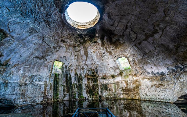 Interior of ancient Roman bath with domed ceiling at the Archaeological Park of the Baths of Baiae.