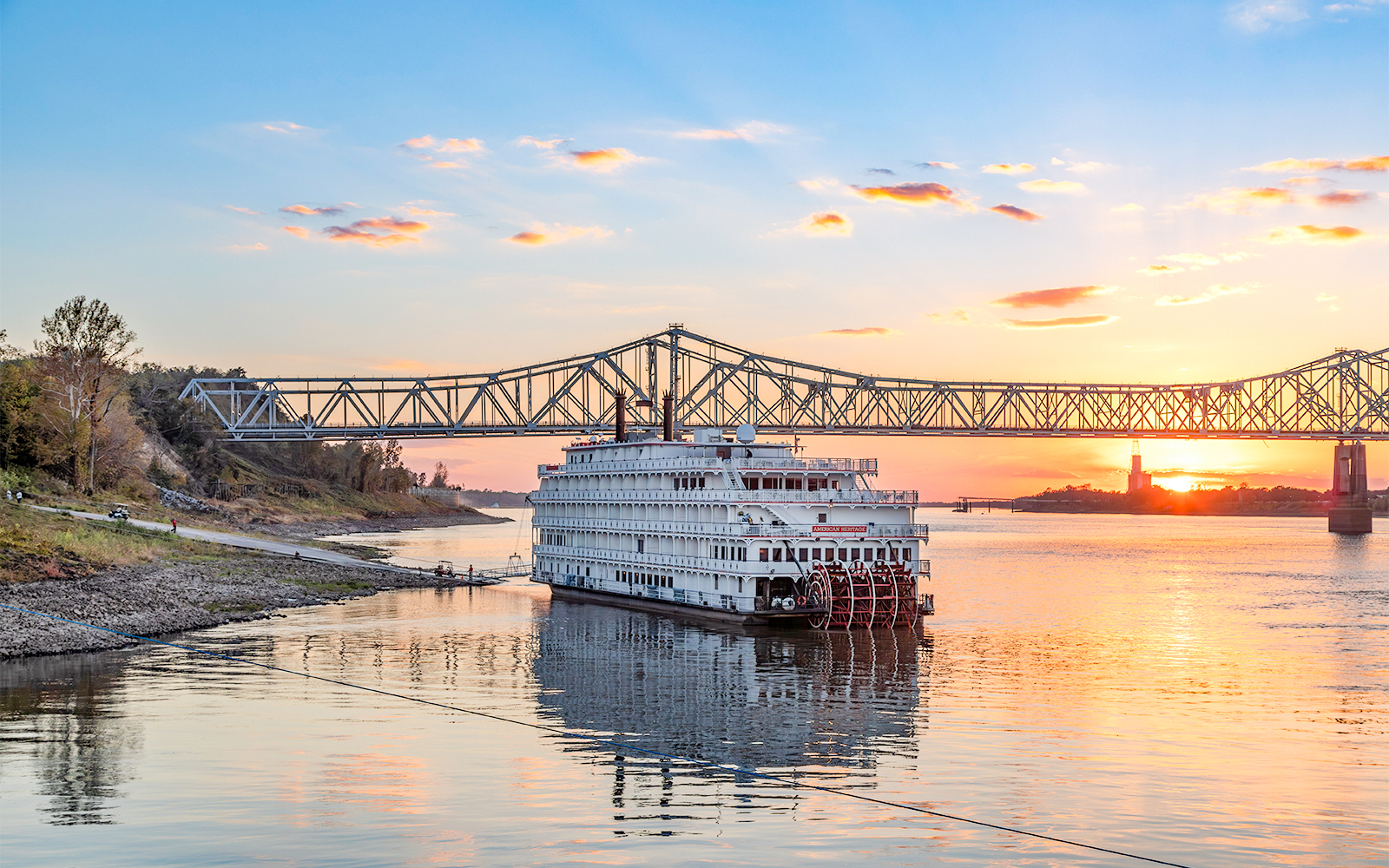 Steamboat Natchez during Sunset in front of the Crescent Bridge on the Mississippi River