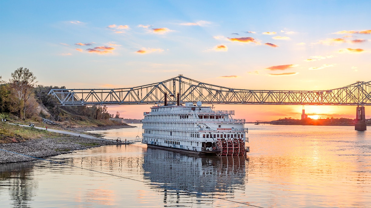 Steamboat Natchez during Sunset in front of the Crescent Bridge on the Mississippi River