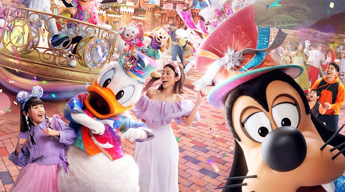 Disneyland Hong Kong 20th anniversary celebration with characters and castle.