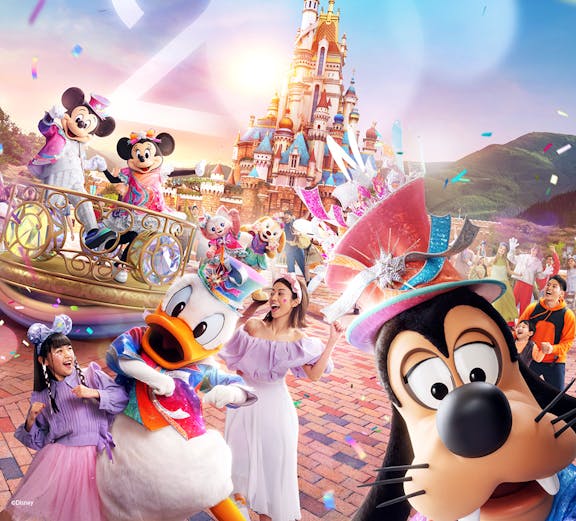 Disneyland Hong Kong 20th anniversary celebration with characters and castle.