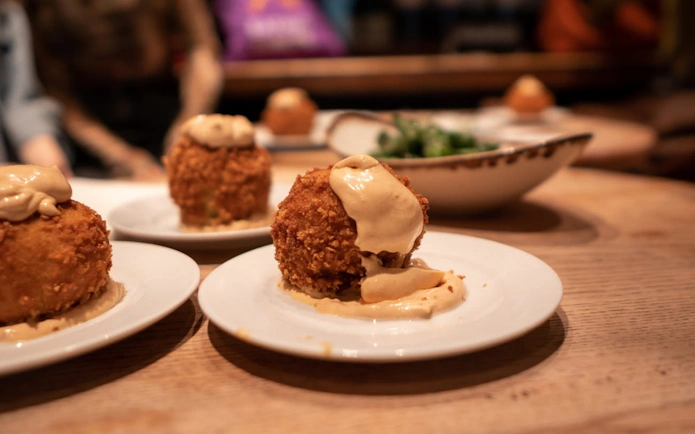 Tapas dish with creamy sauce on a Barcelona wine tour.