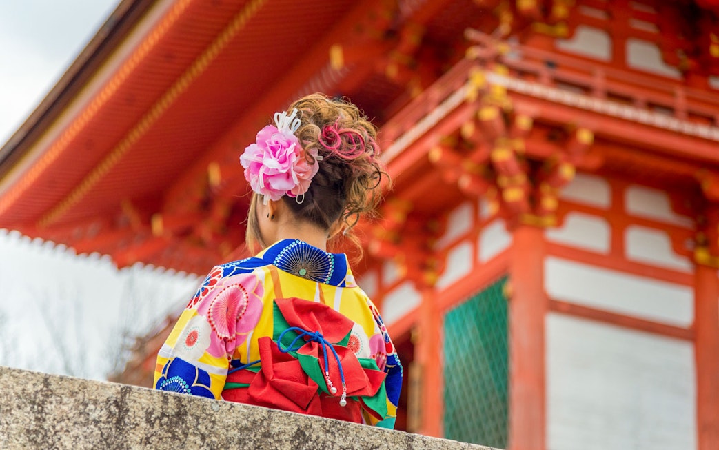 Person in colorful kimono at Kiyomizu Temple, Kyoto.