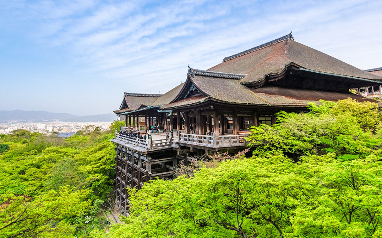 Kiyomizu-dera Temple surrounded by lush greenery on a day tour in Kyoto.