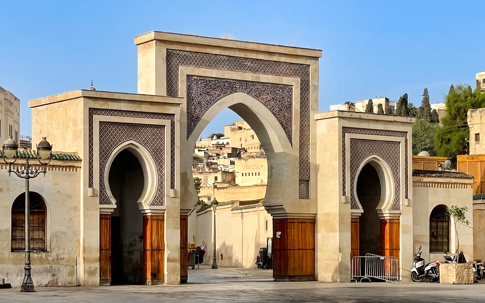 Bab Bou Jeloud gate in Fes Medina, Morocco, with intricate tilework and archways.