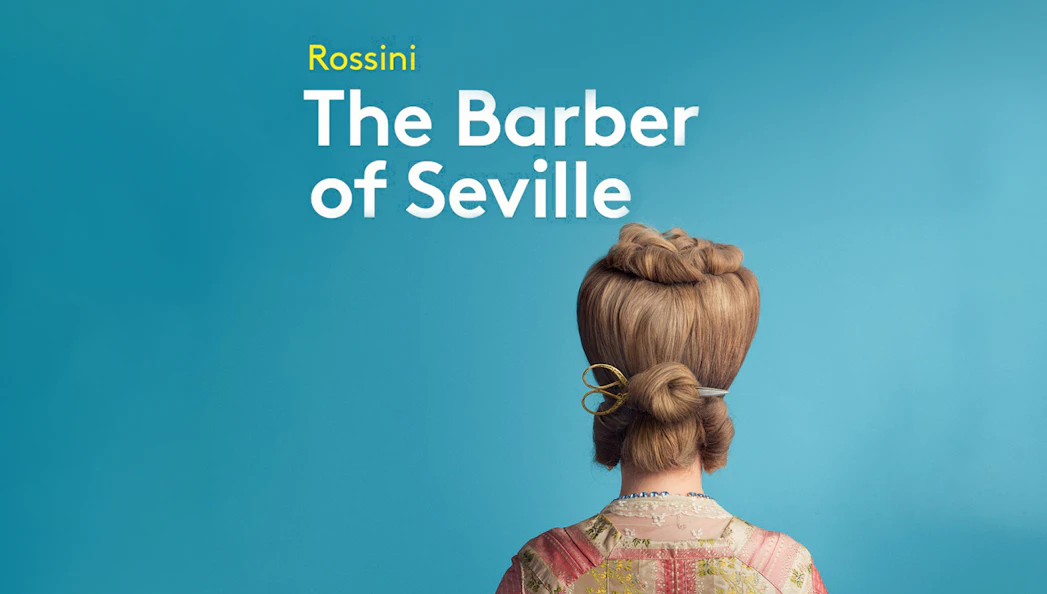 Back view of a person with styled hair and scissors, promoting "The Barber of Seville.