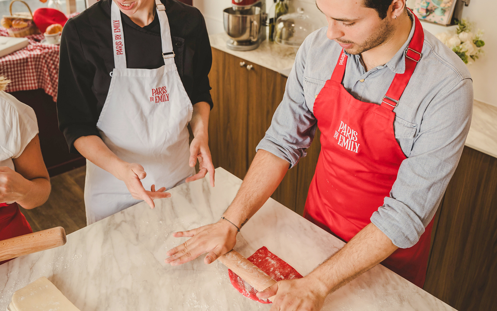 People making croissants at Emily in Paris Croissant-Making Workshop.