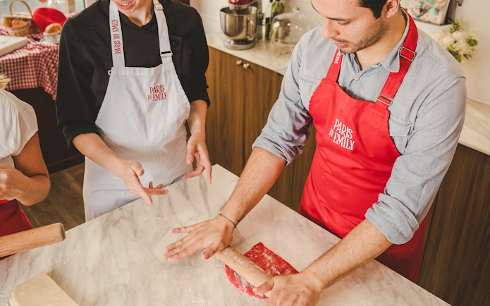 People making croissants at Emily in Paris Croissant-Making Workshop.