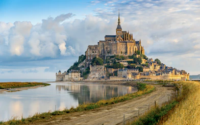 Mont Saint Michel abbey and village on tidal island in Normandy, France.