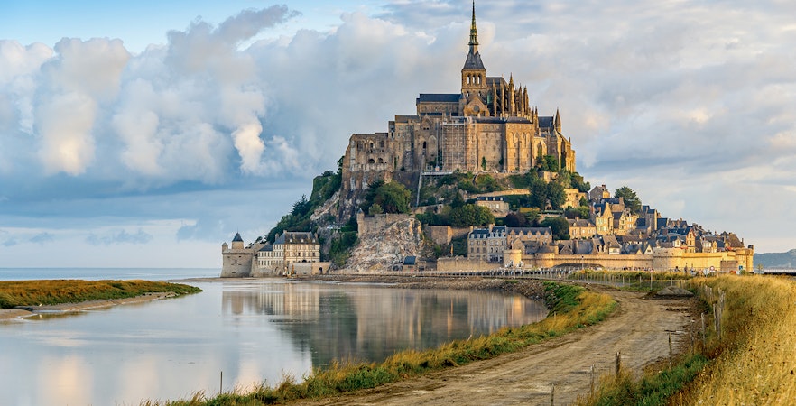 Mont Saint Michel abbey and village on tidal island in Normandy, France.