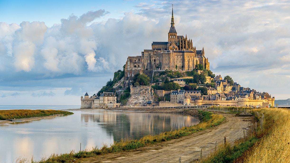 Mont Saint Michel abbey and village on tidal island in Normandy, France.