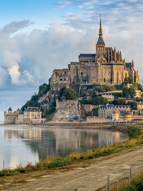 Mont Saint Michel abbey and village on tidal island in Normandy, France.