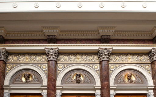 Ornate architectural details inside the National Gallery, London, featuring decorative columns and reliefs.