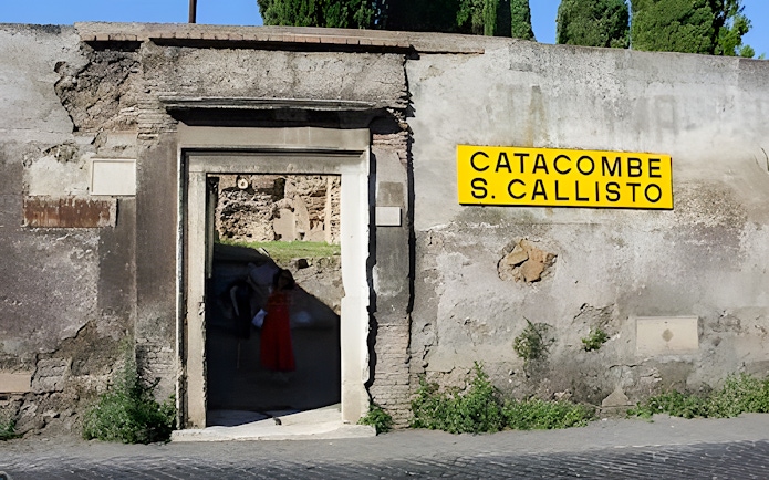 Tourists entering the Catacombs of St. Callixtus in Rome, Italy.