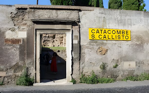Tourists entering the Catacombs of St. Callixtus in Rome, Italy.
