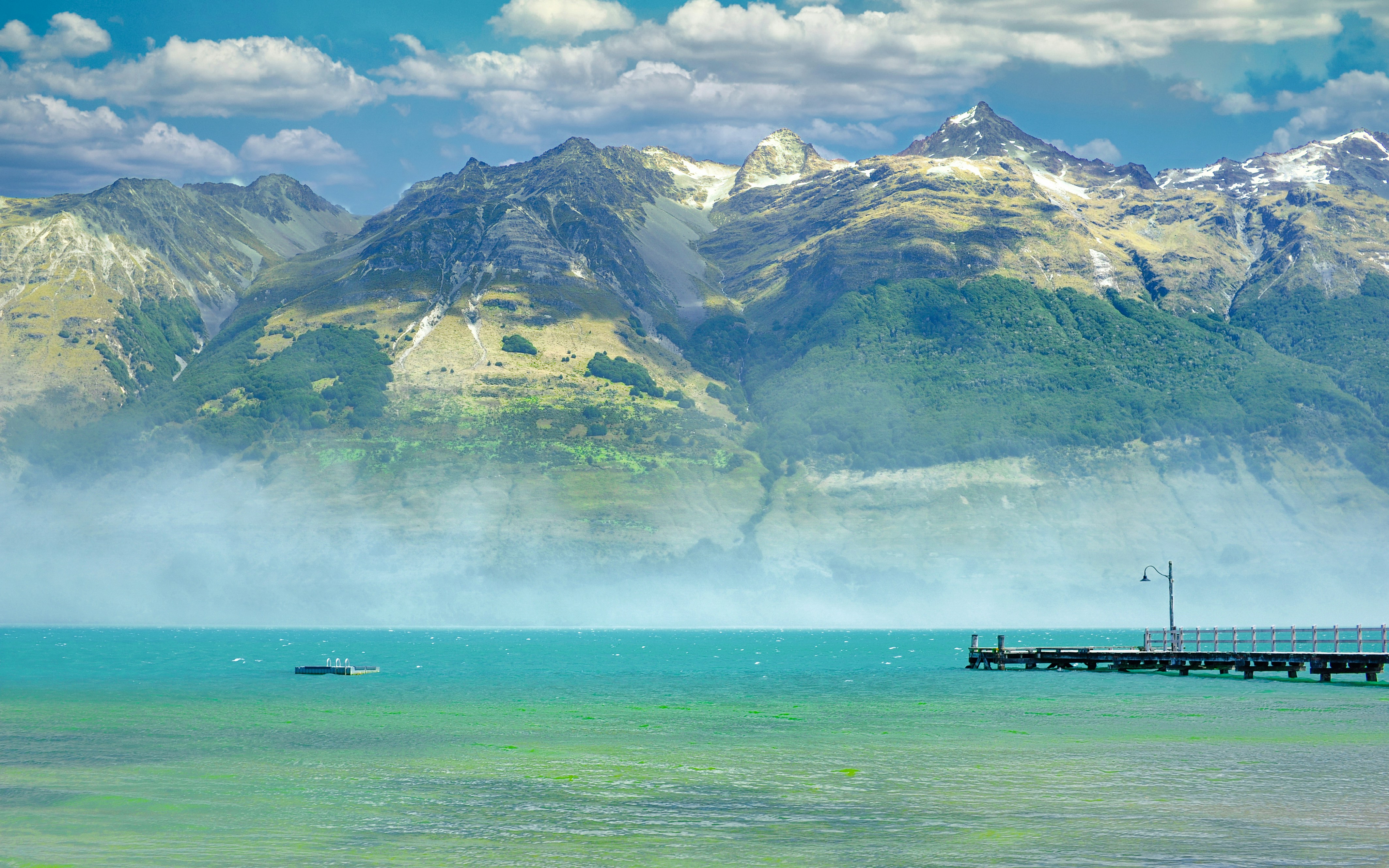 Lake Wakatipu with wharf and mountains near Glenorchy, Queenstown Bay.